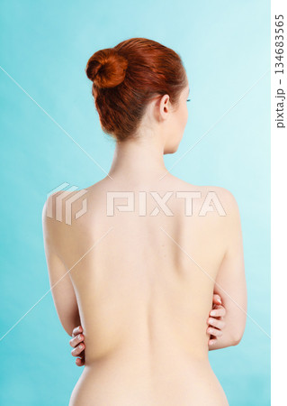 Young woman with naked back 134683565