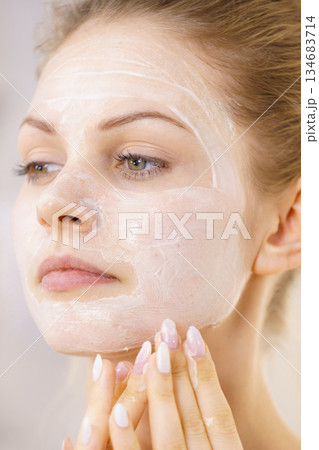 Girl apply cream cosmetic Girl apply cream cosmetic 134683714