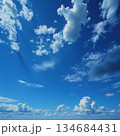 AI generated Vast and clear blue sky extends over peaceful waters basking in sunlight 134684431