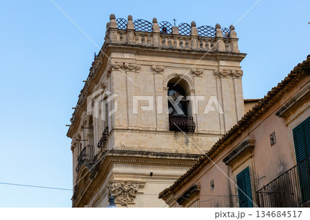Catholic church facade under bright blue sky Catholic church facade under bright blue sky 134684517