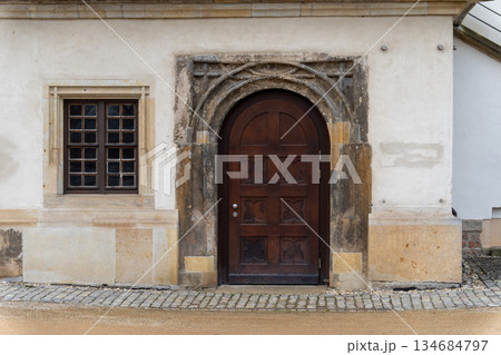 Antique Wooden Door and Stone Archway of Historical Building Antique Wooden Door and Stone Archway of Historical Building 134684797