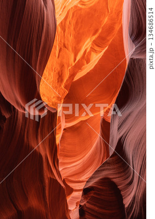 Narrow Slot Canyon Passage with Intense Orange Illumination Narrow Slot Canyon Passage with Intense Orange Illumination 134686514