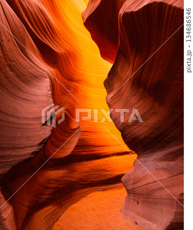Abstract Slot Canyon Walls with Intense Golden Light 134686546