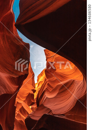 Vertical Shot Upward through Slot Canyon to Sky Above 134686580