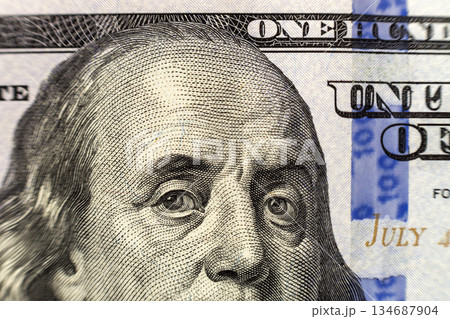 Money, busyness and finances concept. One hundred dollar bill detail with president Franklin portrait close-up. American national currency banknote. Symbol of wealth and prosperity. 134687904