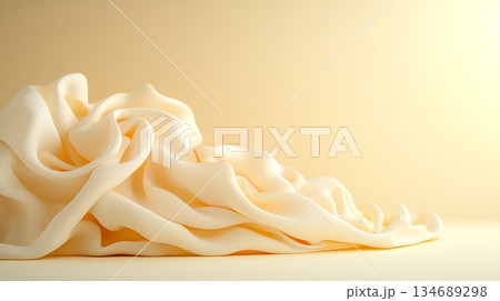 Soft Creamy Fabric Draped Elegantly on Smooth Surface in Warm Lighting 134689298