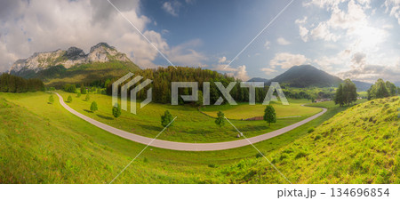 Meadow with road and bench during sunset in Berchtesgaden National Park 134696854