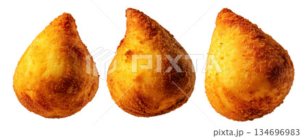 Fried Brazilian coxinhas cone snack filled shredded chicken cheese with golden crispy texture isolated on white background 134696983