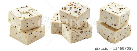 Cubes of seasoned tofu with visible herbs and spices, arranged in stack isolated on white transparent background Cubes of seasoned tofu with visible herbs and spices, arranged in stack isolated on white transparent background 134697089