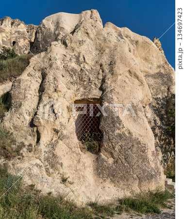 Barred window of a rock-cut church, Goreme Open-Air Museum, Cappadocia, Turkey 134697423