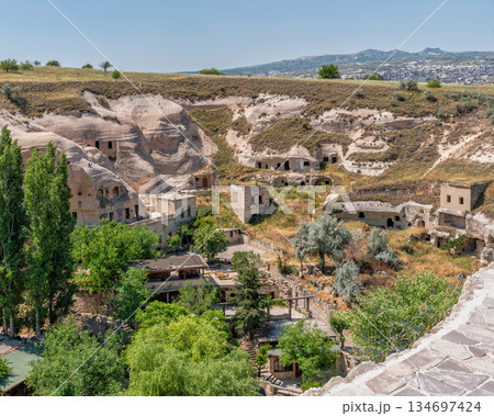 Historic cave dwellings and unique rock formations in Goreme, Cappadocia, Turkey 134697424