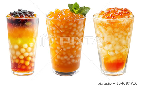 Orange bubble tea Filipino Sagot Gulaman filled with tapioca pearls and topped with mint, isolated on white background. Orange bubble tea Filipino Sagot Gulaman filled with tapioca pearls and topped with mint, isolated on white background. 134697716
