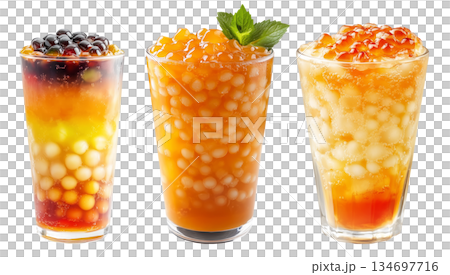 Orange bubble tea Filipino Sagot Gulaman filled with tapioca pearls and topped with mint, isolated on white background. Orange bubble tea Filipino Sagot Gulaman filled with tapioca pearls and topped with mint, isolated on white background. 134697716
