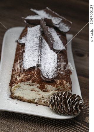 Tiramisu Tronchetto Dessert, Italian Yule Log Christmas dessert with chocolate bark 134700127