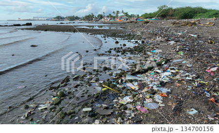 Garbage plastic beach sea waste Cebu landfill ocean pollution bottles coast water trash fishermen litter boats poor people shanty fishing nets Philippines Taytay children people fish landscape place Garbage plastic beach sea waste Cebu landfill ocean pollution bottles coast water trash fishermen litter boats poor people shanty fishing nets Philippines Taytay children people fish landscape place 134700156