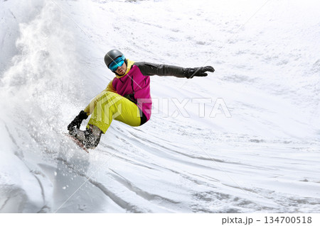 Powerful motion design of snowboarder carving fast turn on steep slope. 134700518