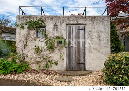 sidewalk by street wall  and  door 134701812