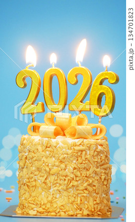 Happy New Year 2026, cute cake with golden ribbon with candle number 2026 for new year celebrate party was lit. blue background with light bokeh, vertical Happy New Year 2026, cute cake with golden ribbon with candle number 2026 for new year celebrate party was lit. blue background with light bokeh, vertical 134701823