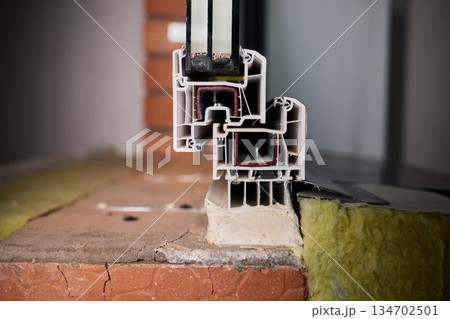 Closeup of window assembly components, Macro view of window frame with insulation and gasket, Technical study of window profile and energy efficient sealing methods 134702501