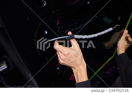 Painter applying new paint, Automotive painter meticulously applying vibrant new coating, Professional person precisely applying glossy fresh paint to vehicle surface Painter applying new paint, Automotive painter meticulously applying vibrant new coating, Professional person precisely applying glossy fresh paint to vehicle surface 134702516