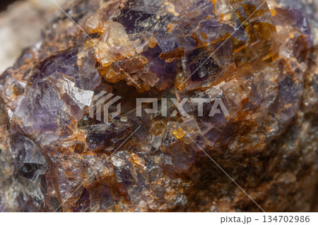 Mineral formation with fluorite crystals found in rock in middle of natural environment Mineral formation with fluorite crystals found in rock in middle of natural environment 134702986