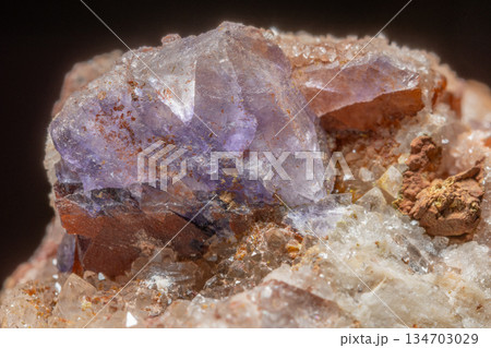 Mineral formation with fluorite crystals found in rock in middle of natural environment Mineral formation with fluorite crystals found in rock in middle of natural environment 134703029
