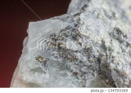 Close-up of mineral with gray crystals and golden shards Close-up of mineral with gray crystals and golden shards 134703169