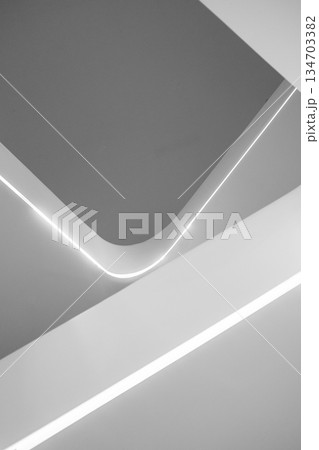 Abstract minimalist architectural detail with curved lines and integrated LED lighting. 134703382