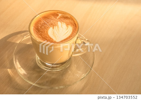Coffee cup latte art on wooden table background with copy space. 134703552