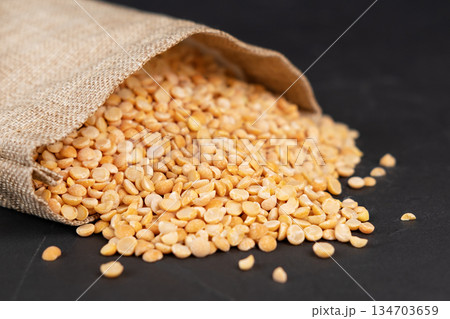 peas in a bag on a black background 134703659