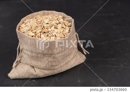 Oatmeal in a bag on a black background 134703660