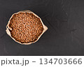 a bag of buckwheat on a black background 134703666