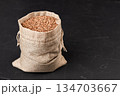 a bag of buckwheat on a black background 134703667