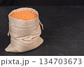 A bag of lentils on a black background 134703673