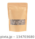 Sunflower seeds in a paper bag isolated on white background 134703680