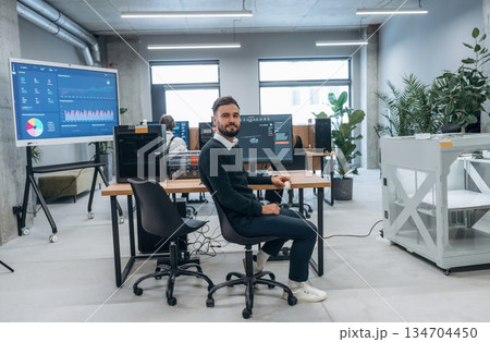 Using 3d printing software. Designer team are together in the office Using 3d printing software. Designer team are together in the office 134704450