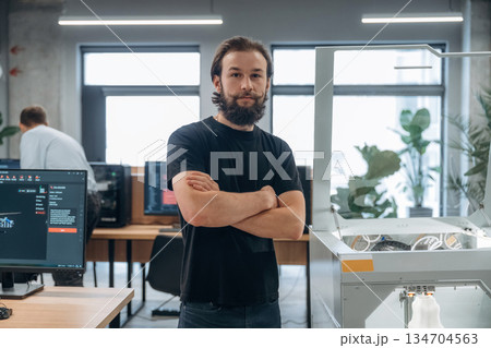 Man is in the office with 3d printer 134704563