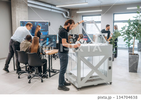High quality 3d printer. People are in the office High quality 3d printer. People are in the office 134704638