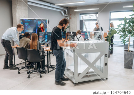 High quality 3d printer. People are in the office 134704640