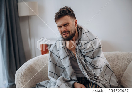 Pain in the throat. Sick man is feeling bad at home Pain in the throat. Sick man is feeling bad at home 134705087