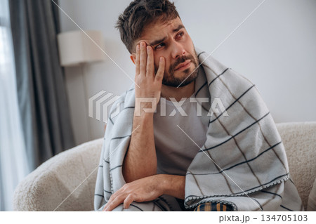 Sad, crying, depression. Sick man is feeling bad at home Sad, crying, depression. Sick man is feeling bad at home 134705103