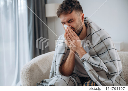Sick man is feeling bad at home Sick man is feeling bad at home 134705107