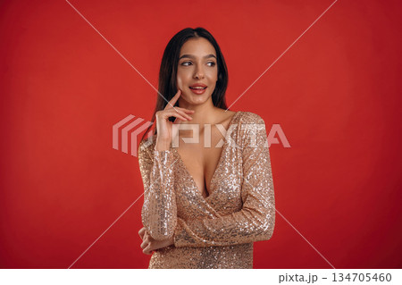 Young elegant woman is against background Young elegant woman is against background 134705460