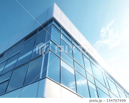 Modern Glass Facade Building with Blue Sky and Clouds Modern Glass Facade Building with Blue Sky and Clouds 134707499