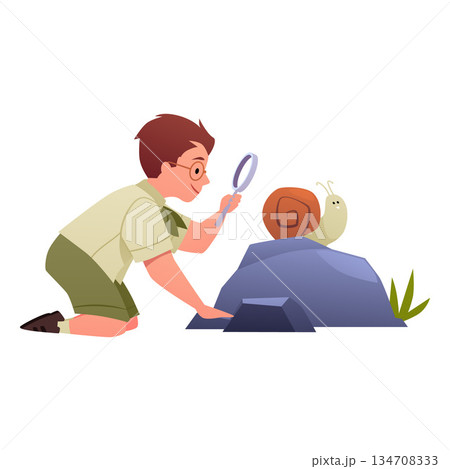 A boy scout kneeling near a rock, examining a snail through a magnifying glass 134708333