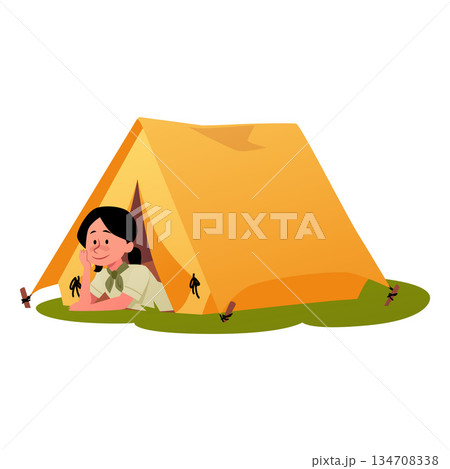 A girl scout peeks out from a yellow tent on green grass. 134708338