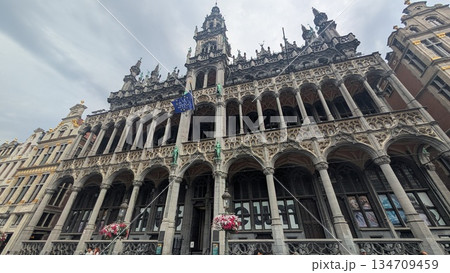 Historic architecture exterior with a flag at Grand-Place in Brussels 134709459