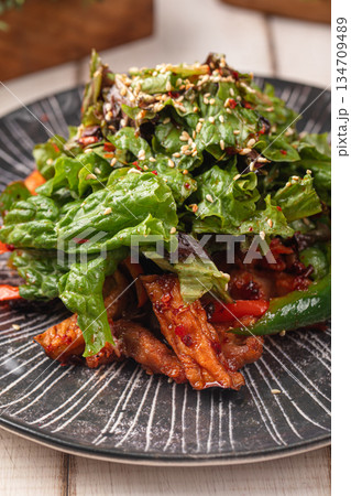 Spicy chicken salad with greens and vegetables Spicy chicken salad with greens and vegetables 134709489