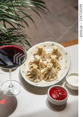Traditional steamed khinkali dumplings on plate 134710299