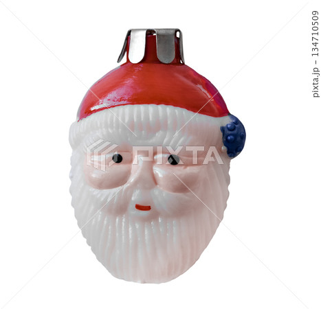 Christmas tree toy in the form of a smiling Santa Claus head. 134710509